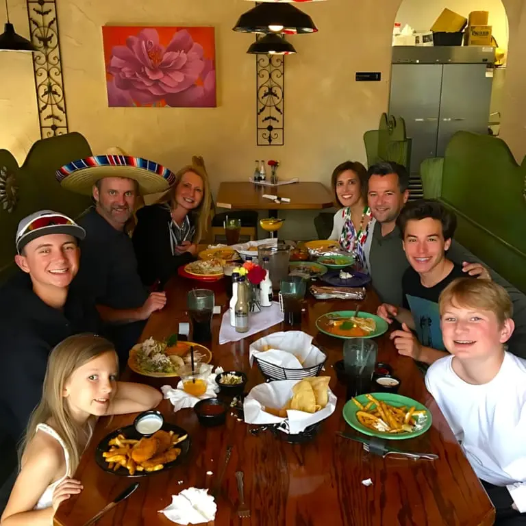 Family and friends dining together at El Jardin